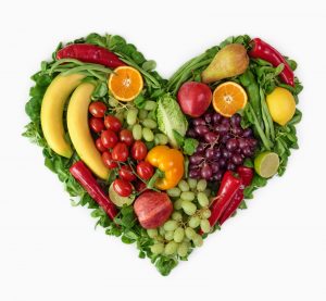 greens and fruits forming heart image